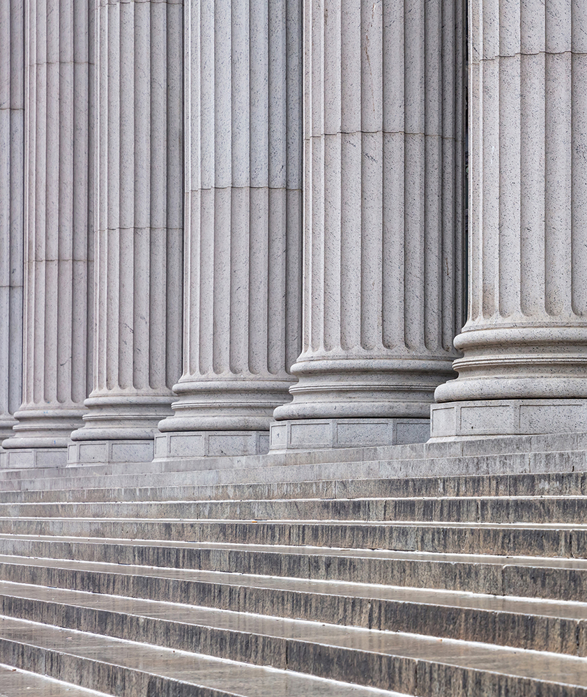 Stairs leading up to columns on a building